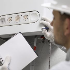 worker-repairing-water-heater